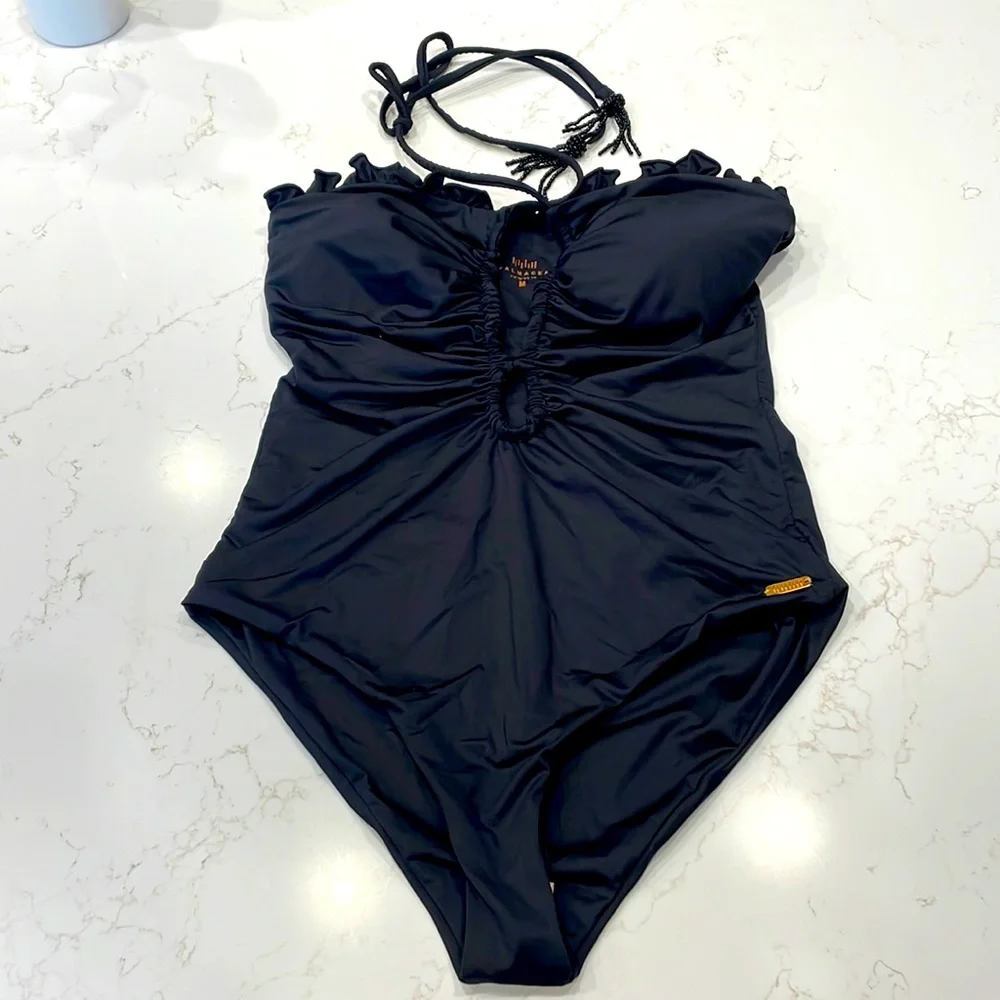 Palmacea, one piece, tied swimsuit with cut outs.
Size M - Picture 1 of 12